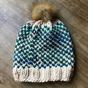 Hand knit wool hat with faux fur pom